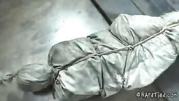 Babe is tied tightly in a sleeping bag and brought in for some lusty beatings
